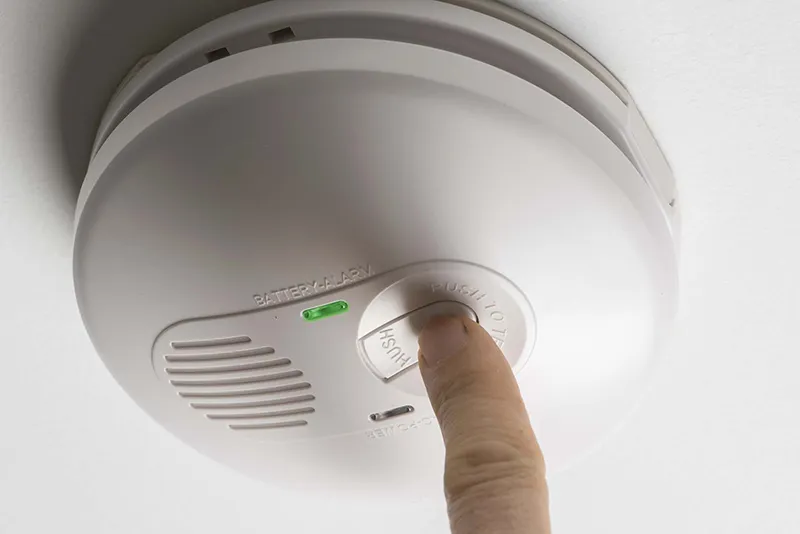 Smoke alarm installed on a residential ceiling